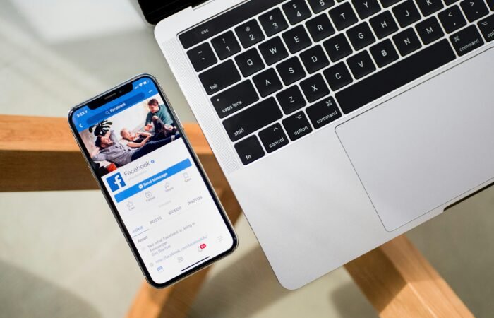 Elevate Your Brand: The Ultimate Guide to Social Media Management in Manchester 1 iPhone X beside MacBook